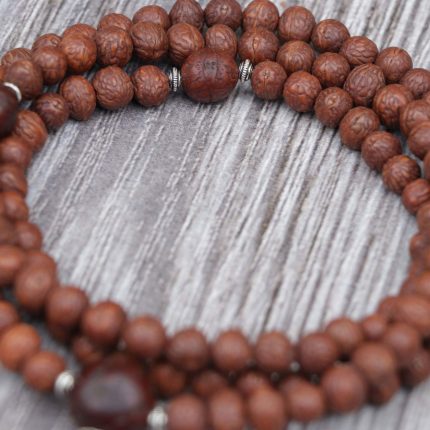 Antique Raktu Seed Japa Mala handmade in Nepal with 108 beads, Bodhi seed spacers, and red nylon string