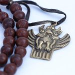 Phoenix Eye Bodhi Seed Mala 12mm beads with brass and skull spacers handcrafted in Nepal