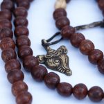 Phoenix Eye Bodhi Seed Mala 12mm beads with brass and skull spacers handcrafted in Nepal