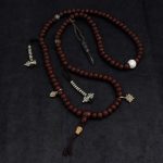 Phoenix Eye Nepali Bodhi seed mala with brass inlay and conch shell beads handmade in Nepal