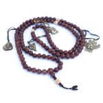 Phoenix Eye Bodhi Seed Mala 12mm beads with brass and skull spacers handcrafted in Nepal
