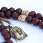 Phoenix Eye Bodhi Seed Mala 12mm beads with brass and skull spacers handcrafted in Nepal