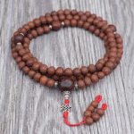 Antique Raktu Seed Japa Mala handmade in Nepal with 108 beads, Bodhi seed spacers, and red nylon string