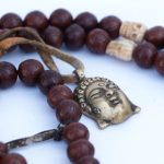 Phoenix Eye Bodhi Seed Mala 12mm beads with brass and skull spacers handcrafted in Nepal