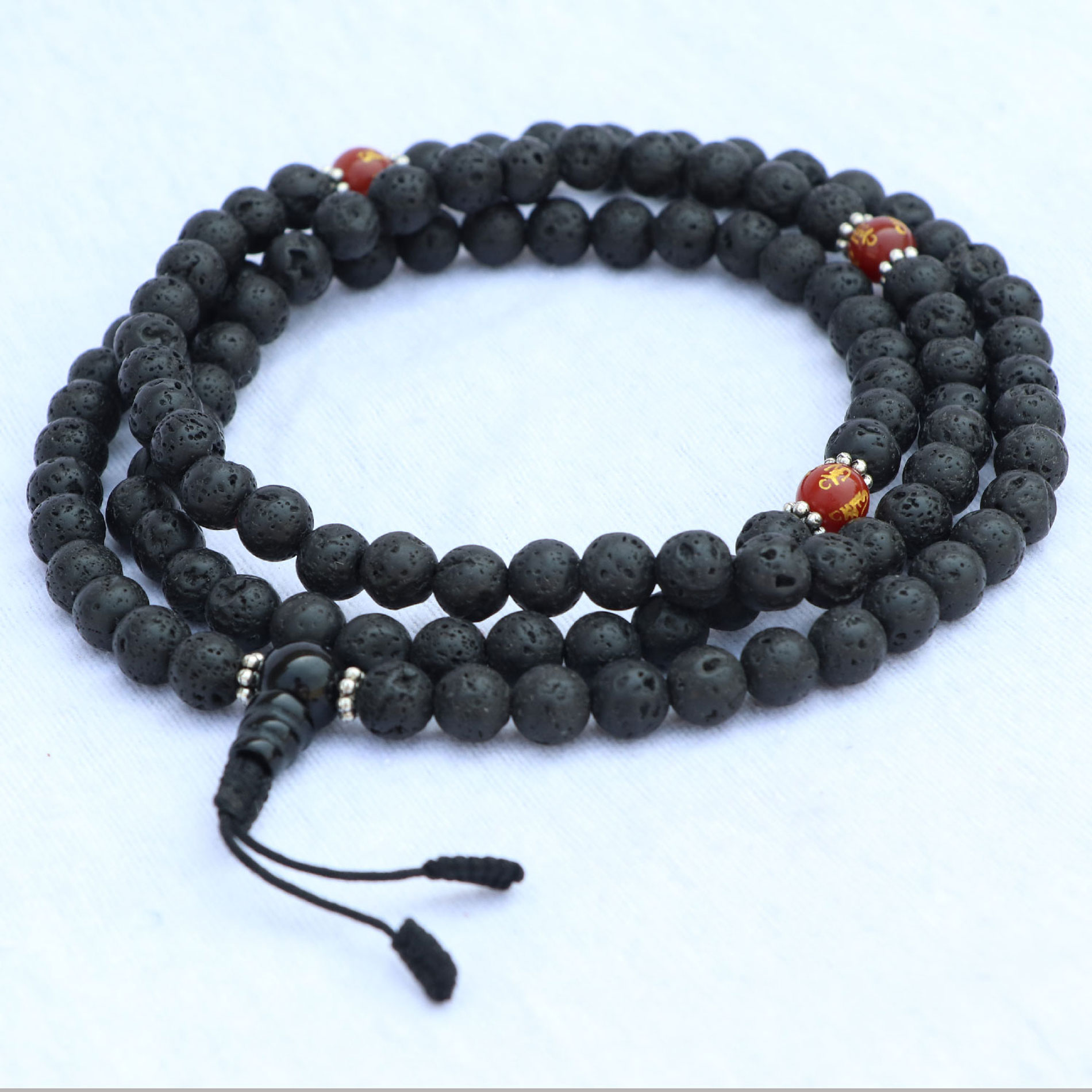 17661187-ea11-4776-8a67-e6f916f8a3d5 Lava Stone Yoga Mala With Carnelian Spacer